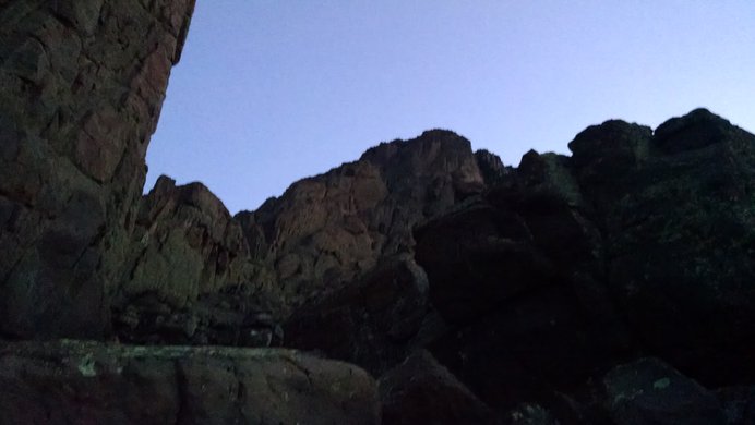 A notch in the rock just below the summit pitch of Wetterhorn Peak