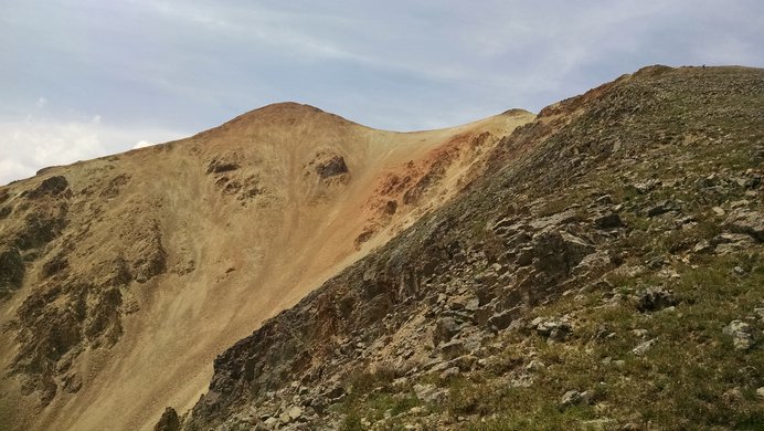 The rusty red summit of Redcloud Peak seen while climbing its east ridge
